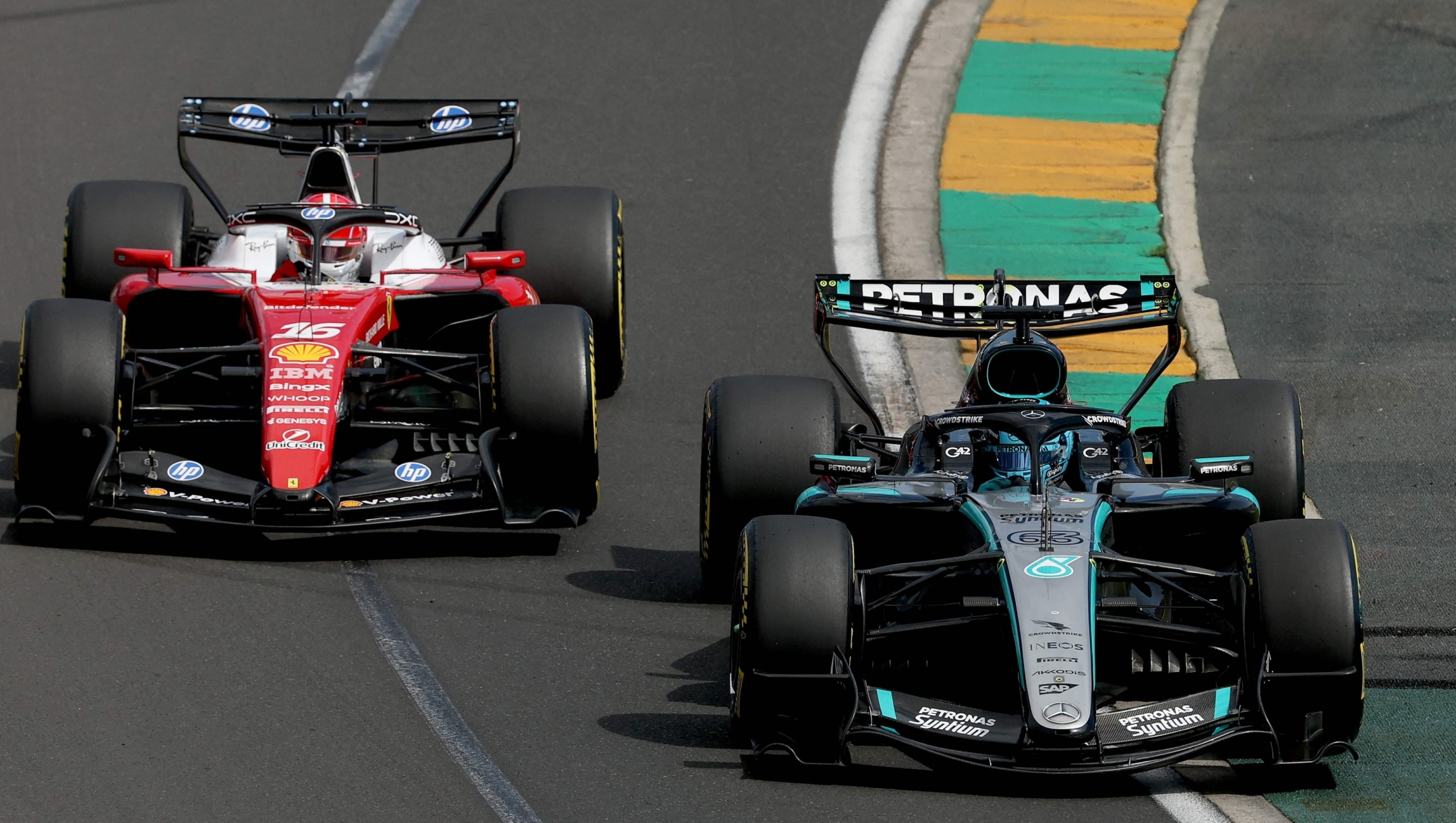 Mercedes' British driver George Russell (R) competes with Ferrari's Monegasque driver Charles Leclerc during the Formula One Australian Grand Prix at Melbournes Albert Park Circuit on March 8, 2026. (Photo by Martin KEEP / AFP) / -- IMAGE RESTRICTED TO EDITORIAL USE - STRICTLY NO COMMERCIAL USE --