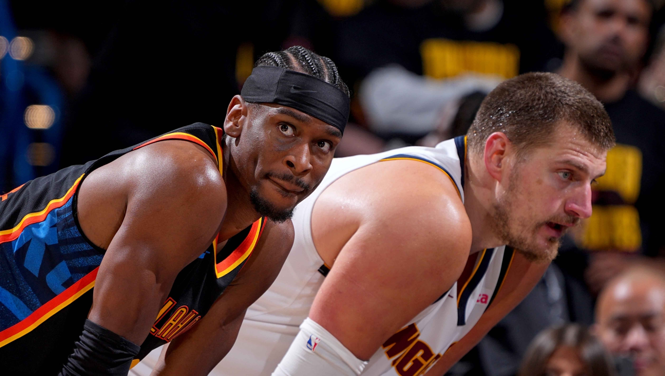  Shai Gilgeous-Alexander #2 of the Oklahoma City Thunder and Nikola Jokic #15 of the Denver Nuggets look on during the game during Round 2 Game 2 of the 2025 NBA Playoffs on May 7, 2025 at Paycom Center in Oklahoma City, Oklahoma. NOTE TO USER: User expressly acknowledges and agrees that, by downloading and or using this photograph, User is consenting to the terms and conditions of the Getty Images License Agreement. Mandatory Copyright Notice: Copyright 2025 NBAE   Garrett Ellwood/NBAE via Getty Images/AFP (Photo by Garrett Ellwood / NBAE / Getty Images / Getty Images via AFP)