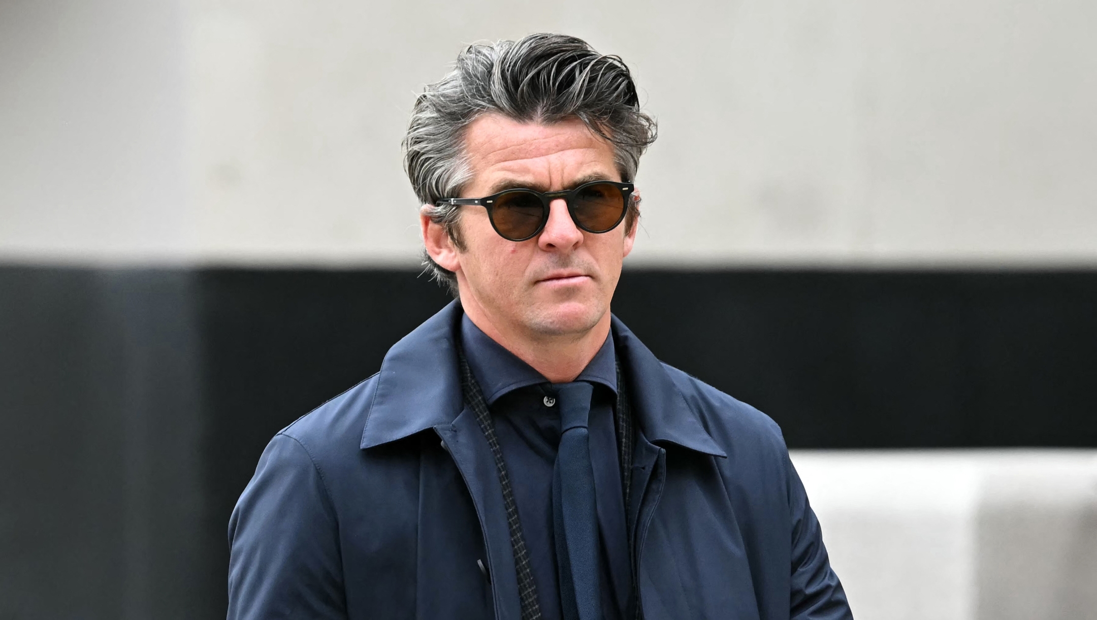 Former footballer Joey Barton arrives at Liverpool Crown Court on August 27, 2024, accused of an offence of malicious communications relating to tweets he made in January this year. Former Manchester City and Newcastle midfielder Joey Barton has been charged with sending malicious online communications. The charge relates to comments Barton made while criticising football pundit Eni Aluko during her commentary on an FA Cup match broadcast by the BBC in January. (Photo by Paul ELLIS / AFP)