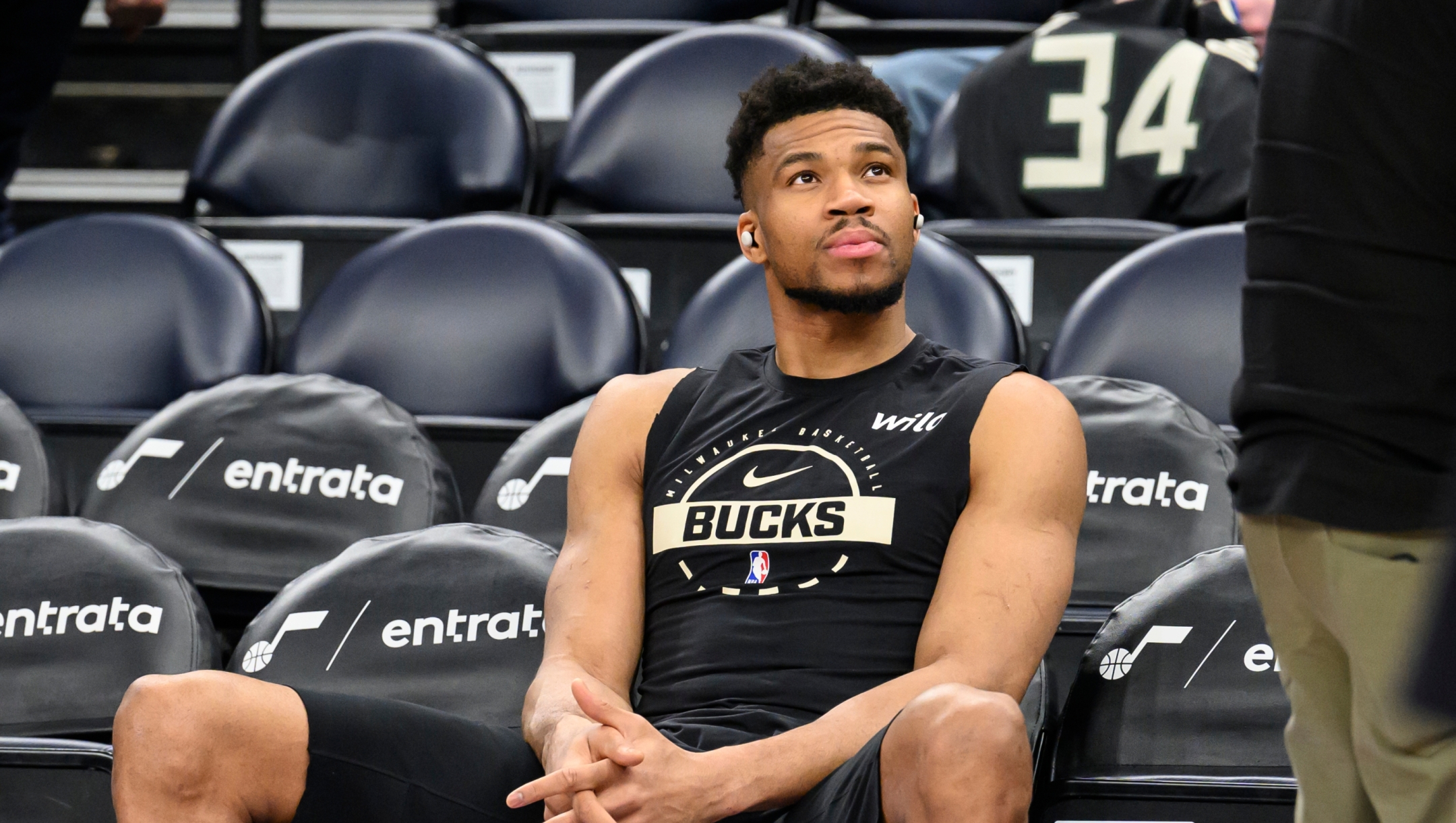 Milwaukee Bucks forward Giannis Antetokounmpo watches the warmup session before an NBA basketball game against the Utah Jazz, Thursday, March 19, 2026, in Salt Lake City. (AP Photo/Tyler Tate)