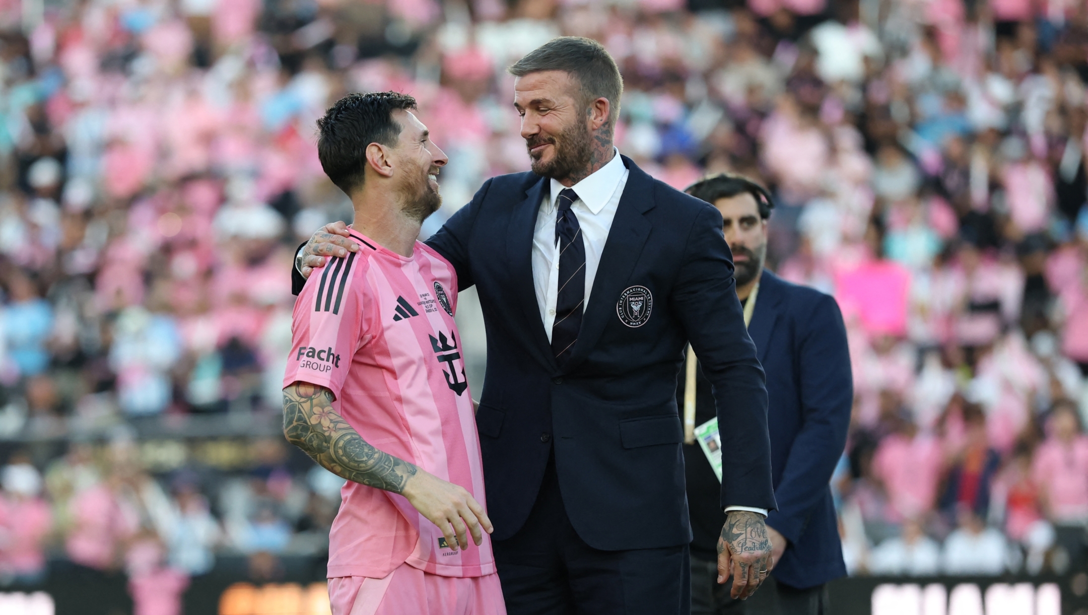  Lionel Messi #10 of Inter Miami CF greets David Beckham, co-owner of Inter Miami CF, after winning the Championship following the Audi 2025 MLS Cup Final match between Inter Miami CF and Vancouver Whitecaps FC at Chase Stadium on December 06, 2025 in Fort Lauderdale, Florida.   Elsa/Getty Images/AFP (Photo by ELSA / GETTY IMAGES NORTH AMERICA / Getty Images via AFP)