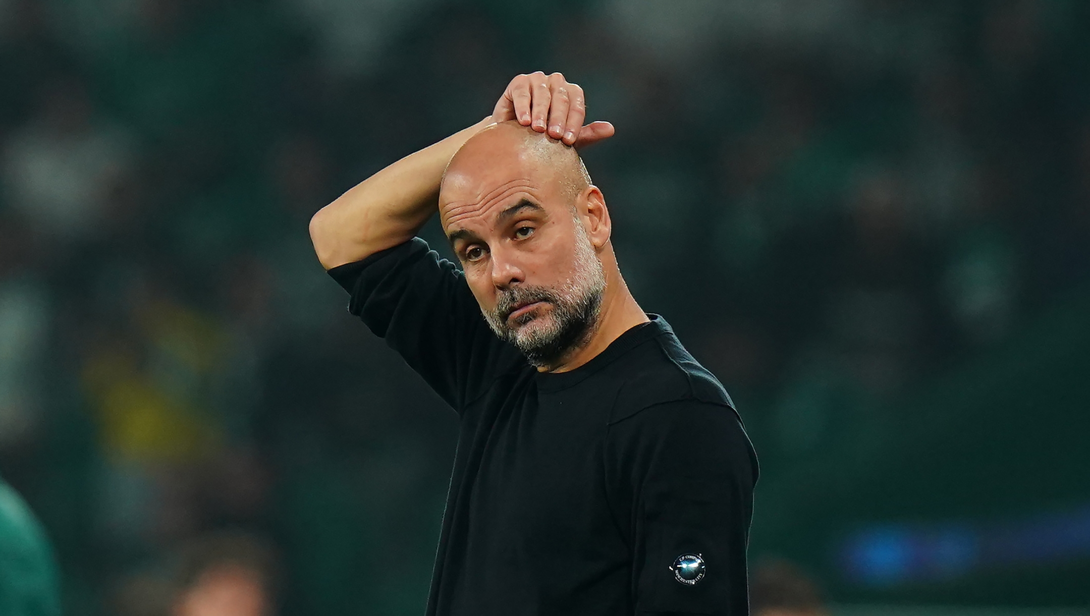  Pep Guardiola, Manager of Manchester City, looks on during the UEFA Champions League 2024/25 League Phase MD4 match between Sporting Clube de Portugal and Manchester City at Estadio Jose Alvalade on November 05, 2024 in Lisbon, Portugal. (Photo by Gualter Fatia/Getty Images)