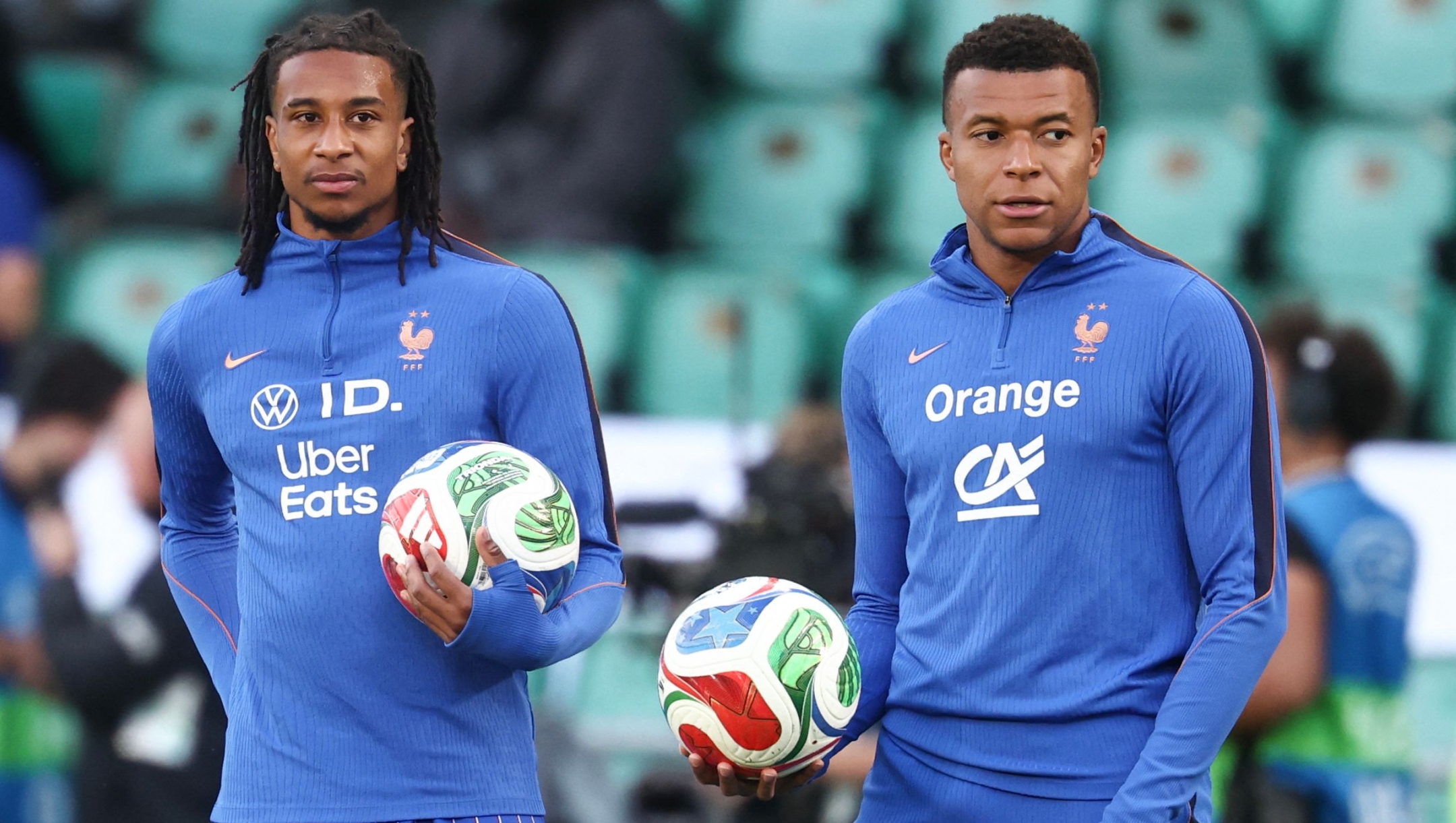 France's forward #10 Kylian Mbappe and France's forward #17 Michael Olise warm up before  the international friendly football match between France and Ivory Coast ahead of the 2026 FIFA World Cup football tournament at the Stade de la Beaujoire in Nantes, western France, on June 4, 2026. (Photo by FRANCK FIFE / AFP)
