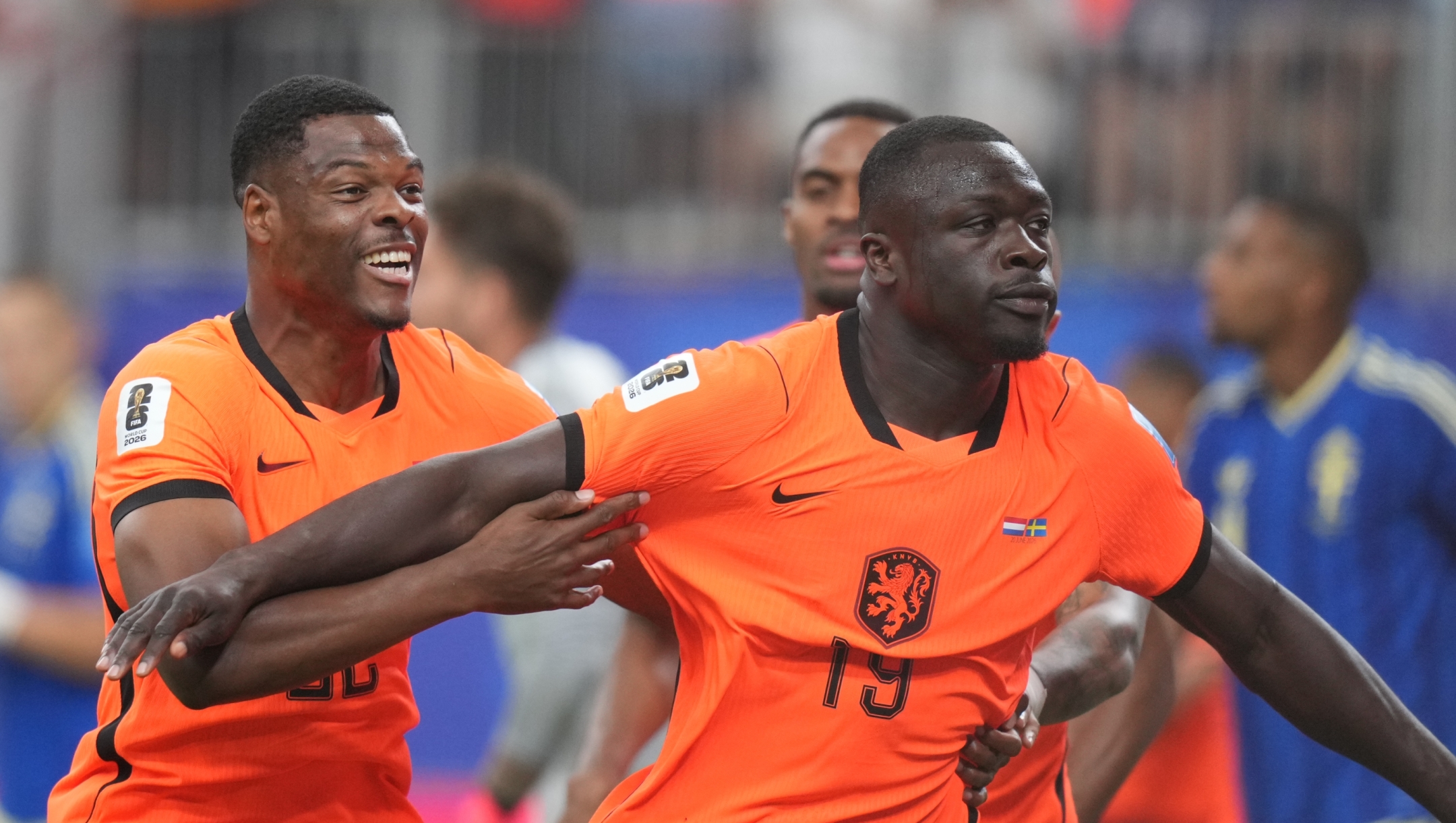 Netherlands' Brian Brobbey, right, celebrates scoring his side's opening goal against Sweden during a World Cup Group F soccer match in Houston, Saturday, June 20, 2026. (AP Photo/Eric Gay)