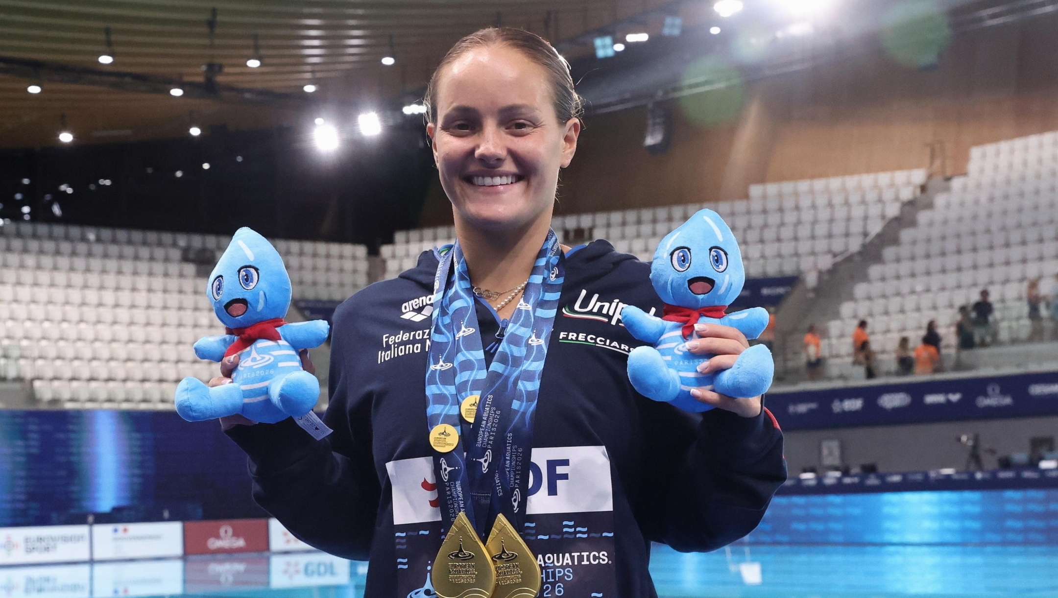 epa13147636 Chiara Pellacani of Italy poses with her gold medals for Mixed Synchronised 3m Springboard and for the Women's 1m Springboard Final of the Diving at the European Aquatics Championships in Paris, France, 02 August 2026.  EPA/TERESA SUAREZ