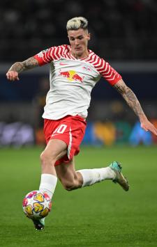 LEIPZIG, GERMANY - APRIL 27: Benjamin Sesko of RB Leipzig celebrates scoring his team's second goal during the Bundesliga match between RB Leipzig and Borussia Dortmund at Red Bull Arena on April 27, 2024 in Leipzig, Germany. (Photo by Stuart Franklin/Getty Images)