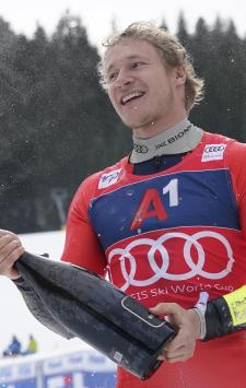 The winner Switzerland's Marco Odermatt celebrates after an alpine ski, men's World Cup giant slalom race, in Bansko, Bulgaria, Saturday, Feb. 10, 2024. (AP Photo/Giovanni Auletta)