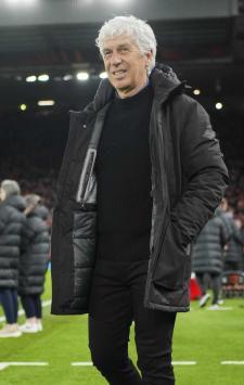 Atalanta's head coach Gian Piero Gasperini enters to the pitch for the Europa League quarter final first leg soccer match between Liverpool and Atalanta, at the Anfield stadium in Liverpool, England, Thursday, April 11, 2024. (AP Photo/Jon Super)