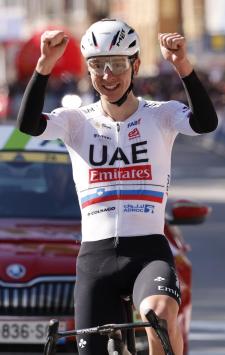 Slovenia's Tadej Pogacar of the UAE Emirates team crosses the finish line to win the Belgian cycling classic and UCI World Tour race Liege Bastogne Liege, in Liege, Belgium, Sunday, April 21, 2024. (AP Photo/Geert Vanden Wijngaert)
