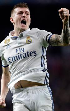 FILE - Real Madrid's Toni Kroos celebrates with the trophy after the Champions League final soccer match between Real Madrid and Atletico Madrid at the San Siro stadium in Milan, Italy, on May 28, 2016. Real Madrid said the 34-year-old German international ?has decided to bring an end to his time as a professional footballer following Euro 2024.? (AP Photo/Manu Fernandez, File)