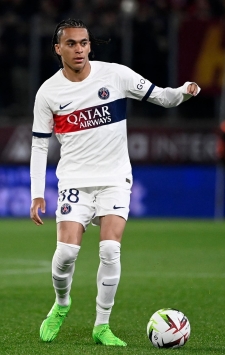 Paris Saint-Germain's French Kylian Mbappe left, and Paris Saint-Germain's Ethan Mbappe right pose with their mother Fayza Lamari as they celebrates PSG's French League One title after the French League One soccer match between Paris Saint-Germain and Toulouse at the Parc des Princes stadium in Paris, Sunday, May 12, 2024. (Franck Fife, Pool via AP)