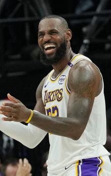 SACRAMENTO, CALIFORNIA - DECEMBER 21: LeBron James #23 of the Los Angeles Lakers reacts after Cam Reddish #5 makes a basket and gets fouled on the shot against the Sacramento Kings during the second half at Golden 1 Center on December 21, 2024 in Sacramento, California. NOTE TO USER: User expressly acknowledges and agrees that, by downloading and or using this photograph, User is consenting to the terms and conditions of the Getty Images License Agreement.   Thearon W. Henderson/Getty Images/AFP (Photo by Thearon W. Henderson / GETTY IMAGES NORTH AMERICA / Getty Images via AFP)