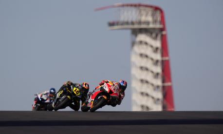 Marc Marquez (93), of Spain, leads Luca Marini (10), of Italy, through a turn during an open practice session for the MotoGP Grand Prix of the Americas motorcycle race at the Circuit of the Americas, Saturday, April 9, 2022, in Austin, Texas. (AP Photo/Eric Gay)