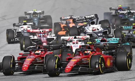 Ferrari's Monegasque driver Charles Leclerc (foreground L) and Ferrari's Spanish driver Carlos Sainz Jr (foreground R) compete during the sprint qualifying at the Red Bull Ring race track in Spielberg, Austria, on July 9, 2022, ahead of the Formula One Austrian Grand Prix. (Photo by JOE KLAMAR / AFP)