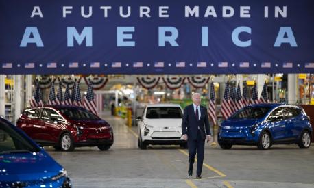 FILE - President Joe Biden arrives to speak during a visit to the General Motors Factory ZERO electric vehicle assembly plant, Wednesday, Nov. 17, 2021, in Detroit. Some Tesla fans and Elon Musk have picked an online fight with Biden over the company being left out as Biden touts EVs as a solution to climate change. ?For reasons unknown," Musk tweeted Sunday, Jan. 30, 2022, referring to the president, ?@potus is unable to say the word ?Tesla.'? (AP Photo/Evan Vucci, File)