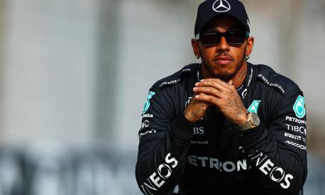ABU DHABI, UNITED ARAB EMIRATES - NOVEMBER 20: Lewis Hamilton of Great Britain and Mercedes looks on ahead of the F1 2022 End of Year photo prior to the F1 Grand Prix of Abu Dhabi at Yas Marina Circuit on November 20, 2022 in Abu Dhabi, United Arab Emirates. (Photo by Mark Thompson/Getty Images)