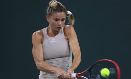 INDIAN WELLS, CALIFORNIA - MARCH 10: Camila Giorgi of Italy plays a backhand in her match against Jessica Pegula of the united States during the BNP Parisbas at the Indian Wells Tennis Garden on March 10, 2023 in Indian Wells, California.   Harry How/Getty Images/AFP (Photo by Harry How / GETTY IMAGES NORTH AMERICA / Getty Images via AFP)