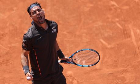 Italy's Fabio Fognini celebrates after winning against Canada's Felix Auger-Aliassime during their men's singles match on day two of the Roland-Garros Open tennis tournament at the Court Simonne-Mathieu in Paris on May 29, 2023. (Photo by Thomas SAMSON / AFP)