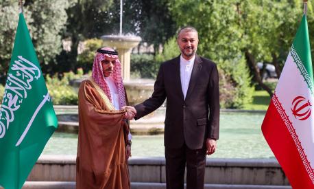 Iran's Foreign Minister Hossein Amir-Abdollahian (R) shakes hands with his Saudi counterpart Faisal bin Farhan in Tehran on June 17, 2023. (Photo by Atta KENARE / AFP)