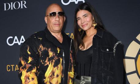 US actor Vin Diesel (L) and wife Paloma Jimenez arrive for the Charlize Theron Africa outreach project block party at the Universal Studios Backlot in Universal City, California, on May 20, 2023. (Photo by VALERIE MACON / AFP)