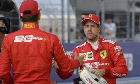 Vettel si congratula con Leclerc. AP