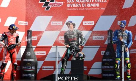 Pecco Bagnaia, Franco Morbidelli e Joan Mir sul podio di Misano il 14 settembre dello scorso anno. Afp