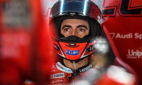 Ducati Italian rider Francesco Bagnaia sits in the box during the first MotoGP free practice session of the Portuguese Grand Prix at the Algarve International Circuit in Portimao on November 5, 2021. (Photo by PATRICIA DE MELO MOREIRA / AFP)