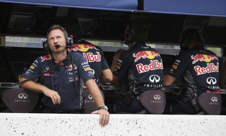 FILE - Red Bull Racing Team principal Christian Horner looks up during the qualifying session for the Japanese Formula One Grand Prix at the Suzuka Circuit in Suzuka, central Japan, Sept. 26, 2015. The Red Bull Formula One team has secured a new title sponsorship worth around $500 million with technology firm Oracle, placing it among the most lucrative commercial deals in sports. The five-year deal is a lift to the team ahead of the season beginning next month when Max Verstappen will be looking to defend his world title in a new Oracle Red Bull Racing car that was also revealed on Wednesday Feb. 9, 2022. (Yuriko Nakao/Pool via AP, file)