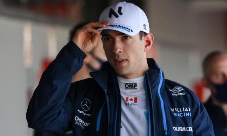 Williams' Canadian driver Nicholas Latifi arrives for a press conference during the first day of the Formula One (F1) pre-season testing at the Circuit de Barcelona-Catalunya in Montmelo, Barcelona province, on February 23, 2022. (Photo by LLUIS GENE / AFP)