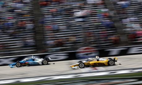 FORT WORTH, TEXAS - MARCH 20: Josef Newgarden, driver of the #2 PPG Team Pensk Chevrolet, crosses the finish line to win ahead of Scott McLaughlin, driver of the #3 XPEL Team Penske Chevrolet, during the NTT IndyCar Series XPEL 375 at Texas Motor Speedway on March 20, 2022 in Fort Worth, Texas.   Chris Graythen/Getty Images/AFP == FOR NEWSPAPERS, INTERNET, TELCOS & TELEVISION USE ONLY ==