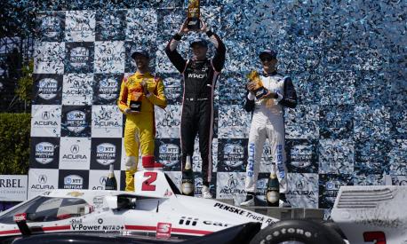 From left, second place winner Andretti Autosport driver Romain Grosjean of France, first place winner Team Penske driver Josef Newgarden of United States, and third place winner Chip Ganassi Racing driver Álex Palou of Spain hold their trophies after an IndyCar auto race at the Grand Prix of Long Beach on Sunday, April 10, 2022, in Long Beach, Calif. (AP Photo/Ashley Landis)