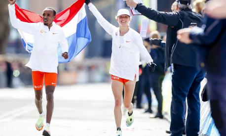 Dutch Abdi Nageeye (L) and Dutch Nienke Brinkman (R) celebrate at the end of the 41th edition of the Rotterdam Marathon in Rotterdam, on April 10, 2022. (Photo by Koen van Weel / ANP / AFP) / Netherlands OUT