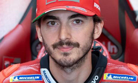 Ducati Italian rider Francesco Bagnaia gets ready in his box during the fourth practice session of the MotoGP Spanish Grand Prix at the Jerez racetrack in Jerez de la Frontera on April 30, 2022. (Photo by JORGE GUERRERO / AFP)