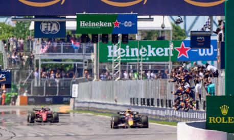 Red Bull Racing's Dutch driver Max Verstappen takes the checkered flag to win the Canada Formula 1 Grand Prix on June 19, 2022, at Circuit Gilles-Villeneuve in Montreal. (Photo by Geoff Robins / AFP)