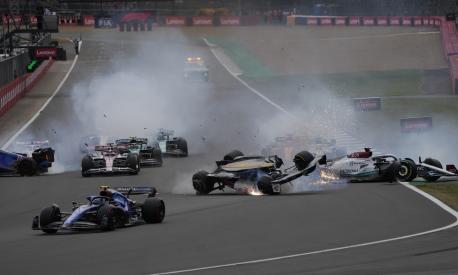 Cars crash at the start of the British Formula One Grand Prix at the Silverstone circuit, in Silverstone, England, Sunday, July 3, 2022. (AP Photo/Frank Augstein)