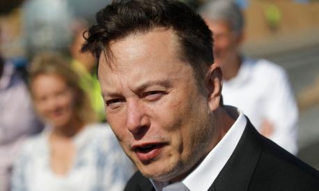 (FILES) In this file photo taken on September 3, 2020 Tesla CEO Elon Musk talks to media as he arrives to visit the construction site of the future US electric car giant Tesla,  in Gruenheide near Berlin. - Elon Musk pulled the plug on his deal to buy Twitter on July 8, 2022, accusing the company of "misleading" statements about the number of fake accounts, a regulatory filing showed (Photo by Odd ANDERSEN / AFP)