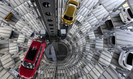 File---File photo shows cars ready for handing over inside one of in total two 'car towers' at the Volkswagen car factory in Wolfsburg, Germany, Monday, Nov. 8, 2021. (AP Photo/Michael Sohn, file)