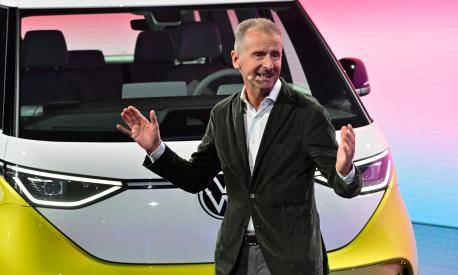 Volkswagen Group chief executive officer Herbert Diess speaks during an event to unveil the new Volkswagen ID Buzz electric van, on March 9, 2022 in Hamburg, northern Germany. - The German automaker unveiled the camper's latest iteration, known as the ID.Buzz, part of the flagship ID line with which Volkswagen is leading a multi-billion-euro charge into the electric car market. (Photo by John MACDOUGALL / AFP)