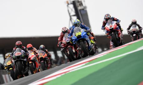 MotoGP riders Fabio Quartararo of France, Jack Miller of Australia, Joan Mir of Spain and Johann Zarco of France, foreground from left to right, lead at the start of the Algarve Motorcycle Grand Prix, at the Algarve International circuit near Portimao, Portugal, Sunday, April 24, 2022. (AP Photo/Jose Breton)