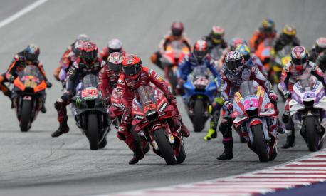 Italy's Francesco Bagnaia rides his Ducati leads at the first lap competes during the Moto GP race as part of the Austrian motorcycle Grand Prix at the Red Bull Ring in Spielberg, Austria, Sunday, Aug. 21, 2022. (AP Photo/Florian Schroetter)