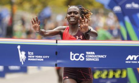 Sharon Lokedi, of Kenya, crosses the finish line first in the women's division of the New York City Marathon, Sunday, Nov. 6, 2022, in New York. (AP Photo/Jason DeCrow)