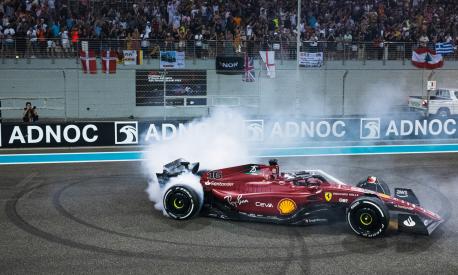 ABU DHABI, UNITED ARAB EMIRATES - NOVEMBER 20: Second placed Charles Leclerc of Monaco and Ferrari performs a celebratory donut in parc ferme following the F1 Grand Prix of Abu Dhabi at Yas Marina Circuit on November 20, 2022 in Abu Dhabi, United Arab Emirates. (Photo by Rudy Carezzevoli/Getty Images)