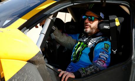 (FILES) In this file photo taken on January 17, 2020, legendary off-road racer and YouTube star Ken Block prepares to take the wheel of Extreme Es E-SUV to take part in the Grand Prix of Qiddiya finale of the Dakar 2020. - The American rally driver Ken Block, a YouTube star best known for his spectacular demonstrations at the wheel of cars in urban environments, was killed while riding a snowmobile in Utah, his sports team announced on December 2, 2023. (Photo by FRANCK FIFE / AFP)
