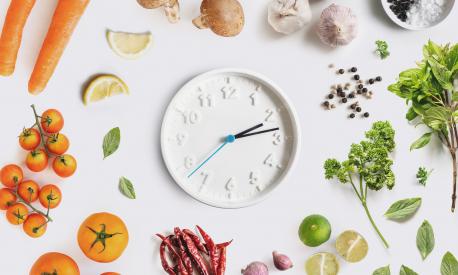 Clock surround with Food ingredient, vegetables and herbal. Dieting and healthy eating concept