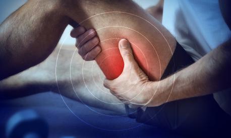 Detail of a representation of pain in the hamstrings with red color on a bluish image.