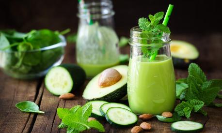 Green detox smoothie with avocado, cucumber, spinach and with fresh mint. Healthy eating, weight loss and dieting concept