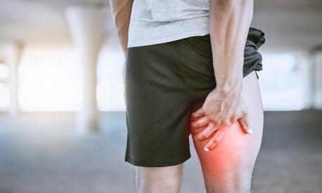 Sports man, runner and thigh injury to hamstring muscle for fitness, wellness and health person. Running, workout and exercise expert suffer medical leg pain after high performance training in city
