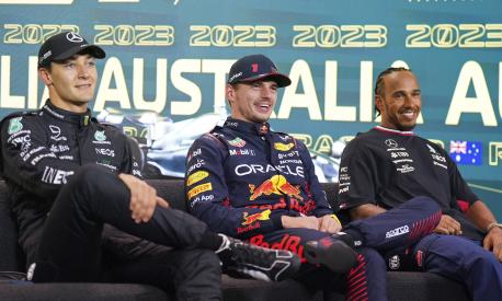 The top 3 fastest qualifiers, Mercedes driver George Russell of Britain, left, Red Bull driver Max Verstappen of Netherlands and Mercedes driver Lewis Hamilton of Britain, right, attend a press conference ahead of the Australian Formula One Grand Prix at Albert Park in Melbourne, Saturday, April 1, 2023. Verstappen qualified fasted, Russell second and Hamilton is 3rd. (AP Photo/Asanka Brendon Ratnayake)