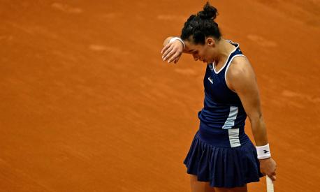 Italy's Martina Trevisan reacts during her 2023 WTA Tour Madrid Open tennis tournament singles match against US Jessica Pegula at the Caja Magica in Madrid on May 1, 2023. (Photo by OSCAR DEL POZO / AFP)