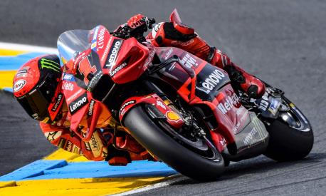 Ducati Lenovo Team's Italian rider Pecco  Bagnaia rides  during the 2nd free practice session ahead of the French MotoGP Grand Prix race of the French motorcycling Grand Prix, in Le Mans, northwestern France, on May 12, 2023. (Photo by JEAN-FRANCOIS MONIER / AFP)